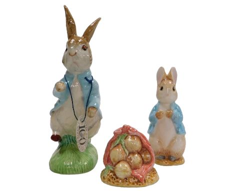 A Royal Albert Beatrix Potter figure of Peter Rabbit, 100 year anniversary, together with World of Beatrix Potter salt and pe