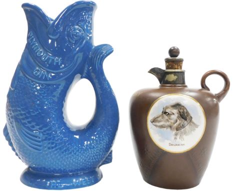 A late 19thC pottery Scotch whisky decanter, of brown simulated leather form, with a reserve of a circular medallion, printed