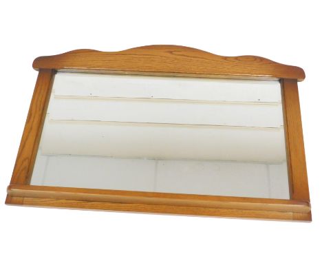 A light oak overmantel mirror, with a rectangular plate, 67cm x 106cm. 
