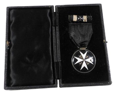 An Order of John of Jerusalem serving brother silver and enamel breast badge, with ribbon, cased.