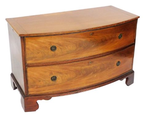 A George III mahogany bow front chest, of two long drawers, raised on bracket feet, 73cm x 118cm x 58cm.