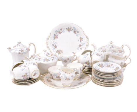 A Paragon porcelain Enchantment pattern tea service, comprising two teapots, hot water jug and cover, pair of bread plates, l