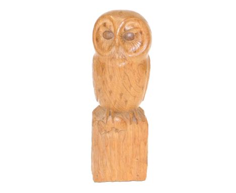 A Robert 'Mouseman' Thompson of Kilburn carved wooden sculpture of an owl, modelled perched with a mouse in its right claw, 3