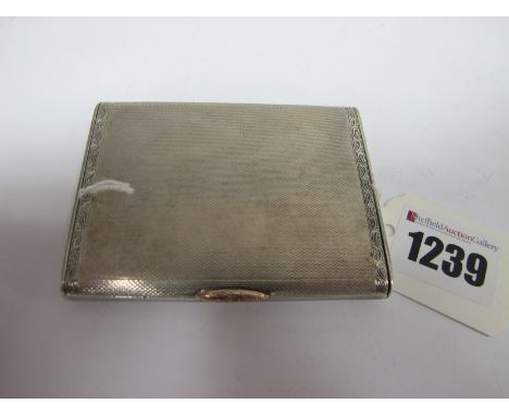 A Hallmarked Silver Case, allover internally and externally engine turned, with engraved thumbpiece, 8.1cm wide.