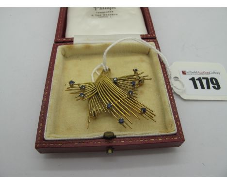 A Vintage 9ct Gold Cocktail Brooch, of abstract openwork design, with claw set highlights.* 8.5 grams