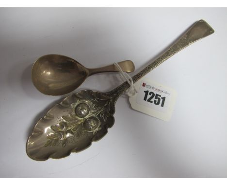 A Hallmarked Silver Berry Spoon, later decorated; a hallmarked silver caddy spoon. (2)