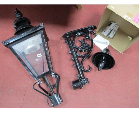 A Black Painted Outdoor Lamp, in the form of a XIX Century gas lamp, with a wall mounting bracket.