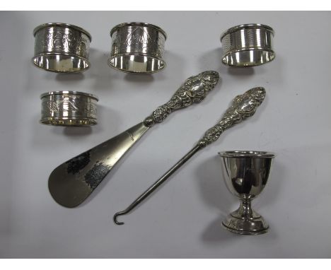 A Pair of Hallmarked Silver Napkin Rings, leaf engraved and initialled; a hallmarked silver egg cup, decorative button hook a