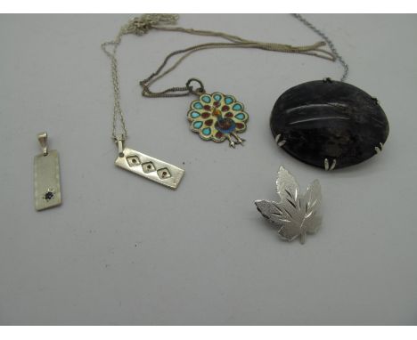 An Oval Blue John Panel Brooch, claw set, (damages), another brooch, of leaf design, with frosted finish, and enamel peacock 