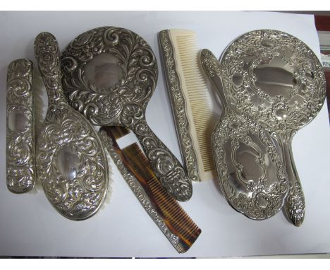 A Hallmarked Silver Backed Four Piece Dressing Table Set, all detailed in relief (comb teeth damaged); a decoration plated th