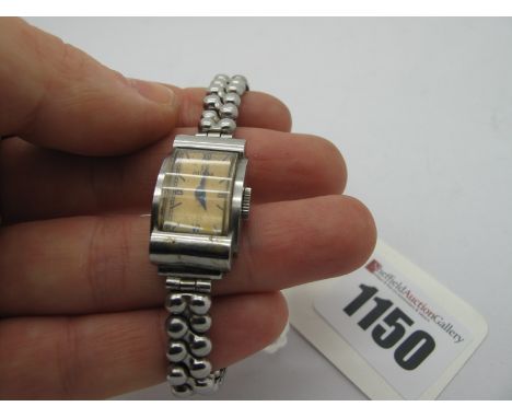 Omega: A Vintage Ladies Wristwatch, the signed dial with Roman numerals, in Art Deco style case, stamped "Omega" "Fab-Suisse"