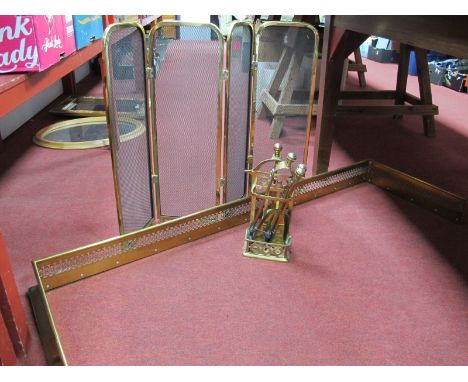 A Pierced Brass Fender, folding fireguard and brass companion set. (3)