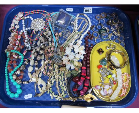 A Selection of Costume Jewellery, including various bead necklaces, ornate floral necklaces, etc, a small selection of rings,