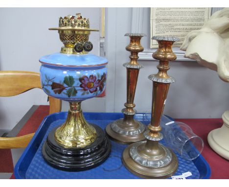 A XIX Century Oil Lamp, glass funnel, glass well, with painted floral decoration (cracks to the well) on a stepped base, toge