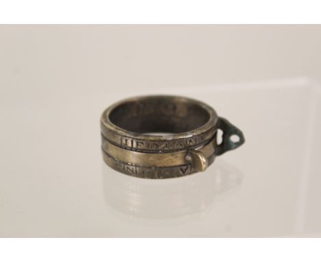 A brass ring sundial, possibly 18th Century, inscribed 'To H.S. Thon Anno 1721' with months of year and hours, sliding ring t