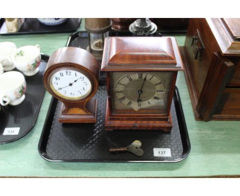 A mahogany mantel clock with silvered dial and Edwardian inlaid mahogany waisted clock