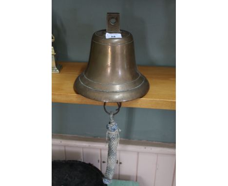 A brass ships bell plus a gymbal table lamp