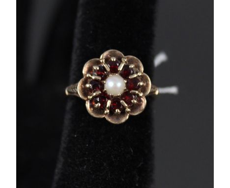 A 9ct gold garnet and pearl floral cluster ring, size N 1/2