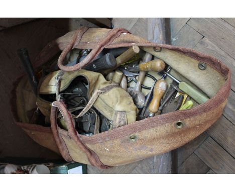 A bag containing woodworking and other tools