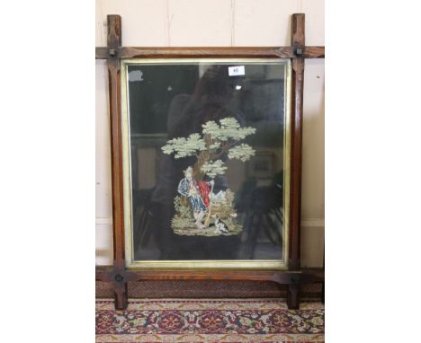 A tapestry in a wooden frame of a man and dog, 19th Century, 20" x 15"