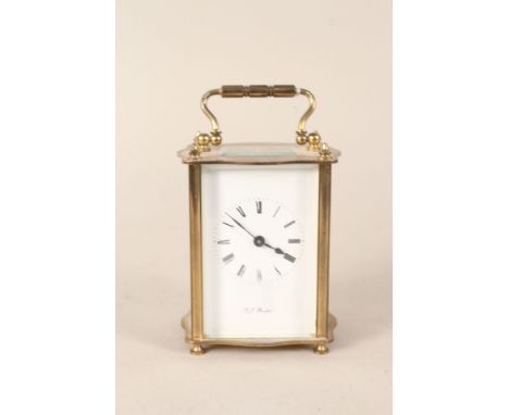 A brass carriage clock, dial marked A J Bradford