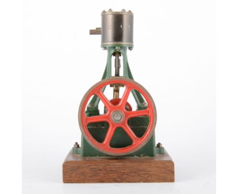 Stuart Turner model of a stationary beam engine, mounted on wood, 18cm tall.