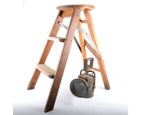 A LNER railway lamp, 27cm tall, and a set of folding steps 65cm tall, (2). 