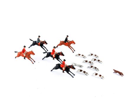 Britains painted lead hunting figures, including five huntsmen on horses, nine hounds and a fox. 