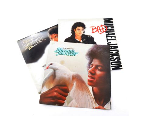 Vinyl music records, a collection of LPs and singles, including Michael Jackson and others. 