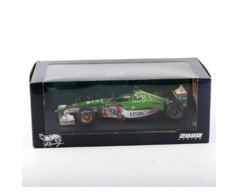 Hotwheels 1:18 scale diecast models, including Jaguar R3 E.Irvine, Jaguar R1, Jaguar R2 and two other models, some loose, (5)