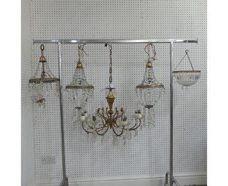 An antique French style eight light brass Chandelier, with scrolled branches and glass lustre drops, not some missing, togeth