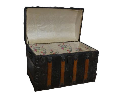 An antique metal and oak bound dome-topped Trunk / Chest, the trunk and hinged lid with oak bound straps and decorative metal