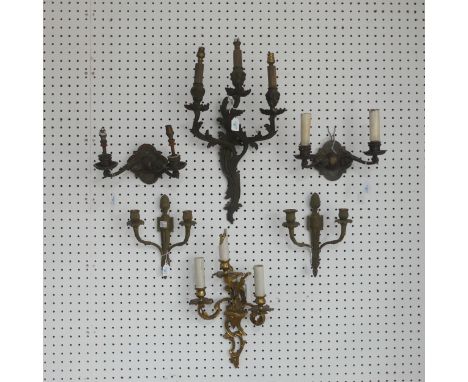 An antique gilt metal three light wall Sconce, of a stylised floral design, L 50 cm, together with another similar wall Sconc
