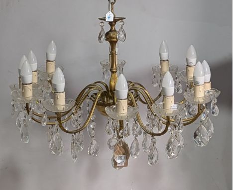 A 20th century gilt metal twelve light Chandelier, decorated with an array of cut and faceted glass drops, H 56 cm. 