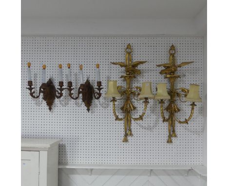 A pair of antique giltwood two light wall Sconces, the finial's in the form of eagles, and with scrolled foliate decorations,