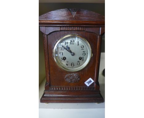 An eight day oak case mantel clock strikes hours and half hour on gong
Condition report: Working with key