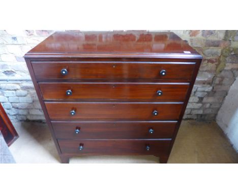 A 19th century mahogany chest of five long graduated drawers raised on bracket supports - 92cm x 49cm x 100cm high