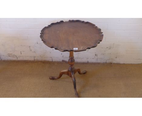 A 19th century mahogany side table with a piecrust top on a tripod base - Height 63cm x Diameter 58cm - needs some restoratio