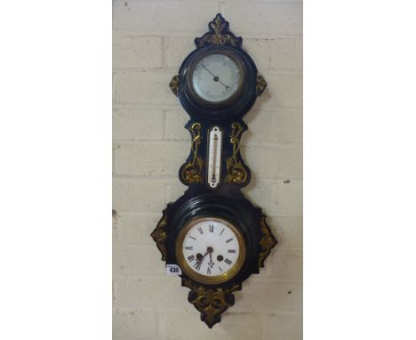 An ebonised clock barometer with thermometer - Height 66cm