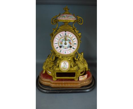 A mid 19th century French ormolu and porcelain mounted mantel clock by JBD - Roman numerals to pink and white dial with gilt 