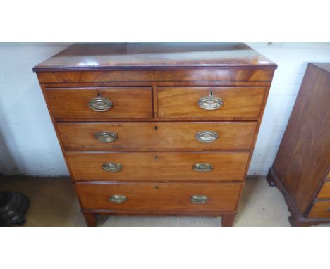 A 19th century mahogany crossbanded and line inlaid chest of two short over three long graduated drawers over shaped apron an