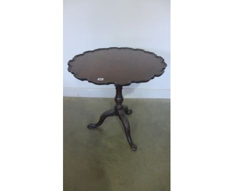 A 19th century mahogany tilt top side table with a piecrust top and birdcage action on a carved tripod base - Height 72cm x D