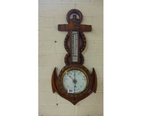 A carved oak aneroid barometer with thermometer in the form of an anchor and rope - Height 55cm - cracks to glass