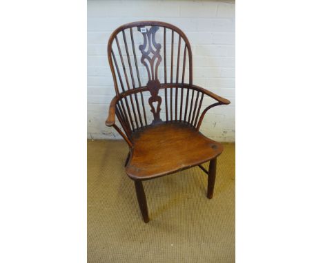 An 18th/19th century yew wood and elm stick back elbow chair possibly replaced front legs 

Provenance: Sherford House, Bromy