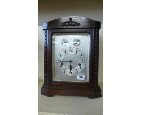 An eight day oak case bracket clock by Junhams, the three train movement chiming quarters and hour
Condition report: Working 