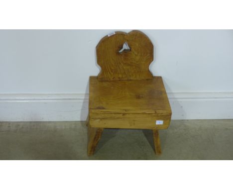 A small vintage pine child's chair or stool, stripped and waxed 