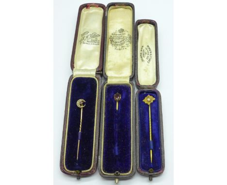 A hallmarked 9ct gold stick pin set with one pearl, Birmingham 1903, 1.1g, one other 9ct gold stick pin, a/f, 0.5g, and a sti