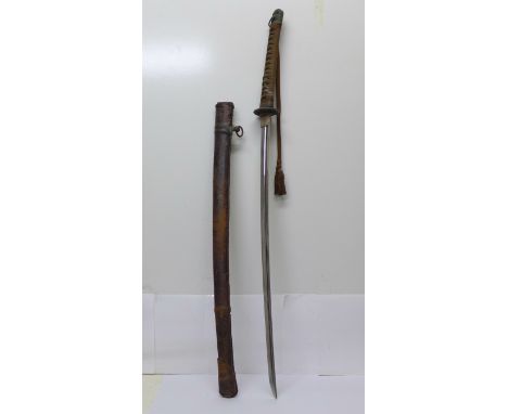 A Japanese WWII military sword, type 94 shin gunto, with scabbard, length of blade 69.5cm