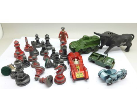 A part lead chess set, a metal bull and four die-cast vehicles 