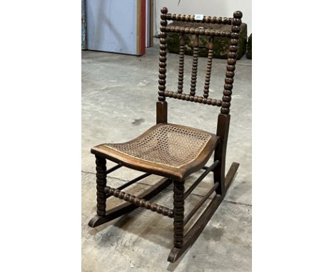 A Victorian bobbin turned rocking chair